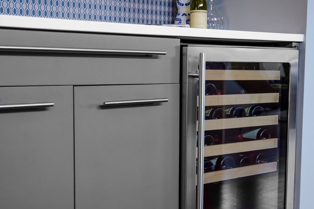 Luxury kitchen design featuring modern cabinetry and a wine cooler, emphasizing smart storage solutions and stylish upgrades for functional home spaces.