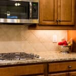 Cabinet Materials | Wood cabinets with countertop and stovetop | Dartmouth Building Supply - DBS